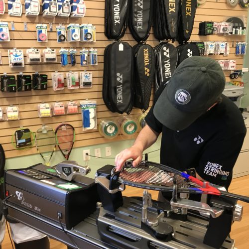 Stringing a squash racquet in our Calgary store.